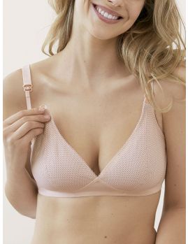 sujetadores lactancia sin aros Miss Mimi, color rosa con puntitos negros sobre copas triangulares. Vista frontal sobre modelo