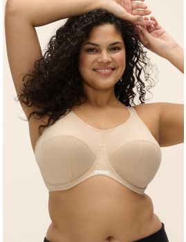 Sujetador deportivo Elomi Energise con aros y sin relleno en color nude, vista frontal sobre modelo